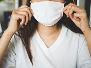 women wearing hygienic mask to prevent the covid-19 or Coronavirus and air pollution, stay on home stop the spread of the virus concept.