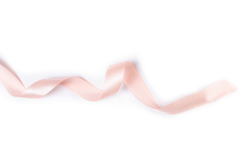 beige, pink satin ribbon isolated on white background
