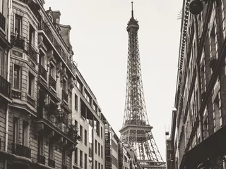  Eiffel Tower surrounded by buildings with monochrome tones - perfect for backgrounds © James Chiello/Wirestock