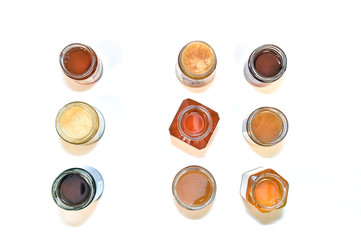 honey jars glasses from the top on the withe background