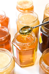 honey jars with teaspoon 