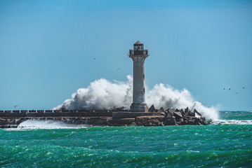 Fototapeta na wymiar Waves crashing on Lighthouse