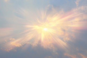 Sky and clouds. The lights of a sun. A plane in the sky will leave traces.