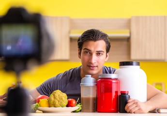 Young man blogging about food supplements