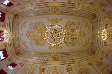 ceiling with chic gold chandeliers