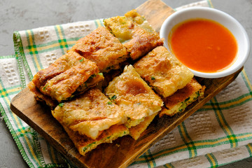 Martabak Telor or Martabak Telur. Savory pan-fried pastry stuffed with egg, meat and spices