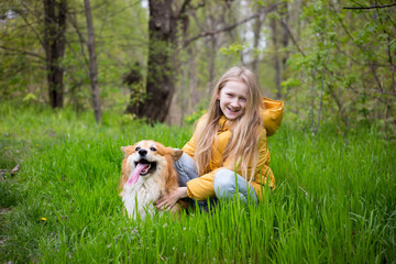 girl with corgi dog outdoors