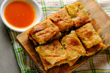 Martabak Telor or Martabak Telur. Savory pan-fried pastry stuffed with egg, meat and spices