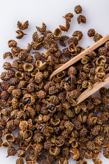 fragrant Sichuan pepper on white acrylic background