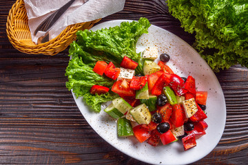 greek salad on dark wooden rustic background