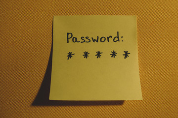 Secret password written on paper note on background. Login access, encryption and cyber security concepts.