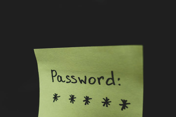 Secret password written on paper note on background. Login access, encryption and cyber security concepts.