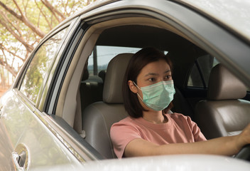 Driver Wearing Protective Face Mask While Driving Car During Pandemic
