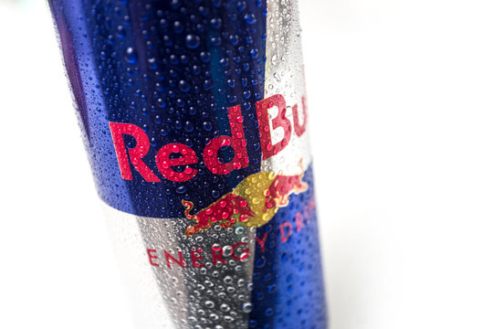 Mulhouse - France - 19 April 2020 - Closeup of drops of water on red bul energy drink can on white background