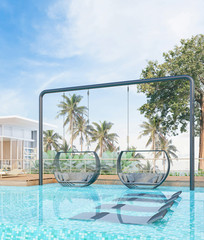 Sea view with a beautiful swimming pool, sunbeds and swings,3d render