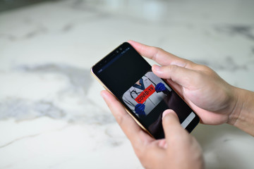 Image showing a man holding a smartphone, the concept of Stop and staying safe from COVID-19.