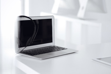 Fototapeta premium Call center and communication support, customer service help desk. VOIP headset on laptop computer