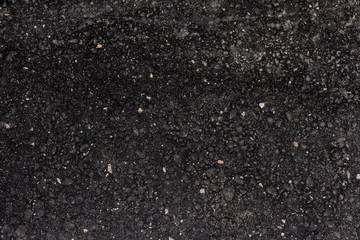 asphalt texture. Black background with rough texture