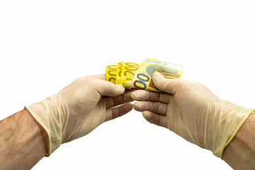 Two hands in white medical protective gloves are counting a bundle of bills with a face value of 200 two hundred euros. Isolated white background. Virus protection concept.