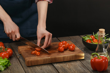 Woman cooking fresh vegetable salad. Female hands. Diet concept for healthy lifestyle with copyspace.