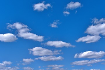 Obraz premium white fluffy clouds in the blue sky
