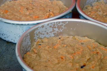 Raw batter for a vegan carrot cake in a cake mold
