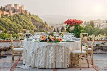 Table with wedding decoration in a restaurant overlooking the Alhambra
