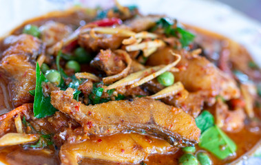 Spicy stir fried fish and herbs. Asian cuisine, delicious stir fried fish with spicy herbs.