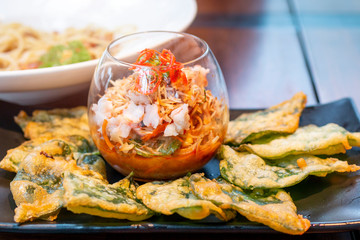 Crispy Water Spinach Spicy Salad. Spicy fried morning glory. Vegetable salad with crispy slug. Spicy Deep Fried Morning Glory Salad.
