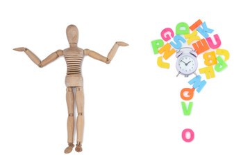Multicolored letters of the English alphabet in the form of a question, a clock and a puppet doll isolated on a white background.