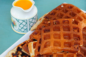 Plate of freshly baked waffles for breakfast