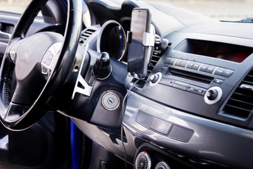 Modern car interior, dashboard and steering wheel. Selective focus.