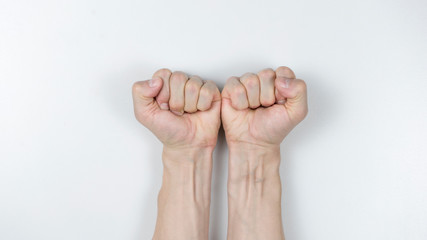 man two fists on white background. Close up