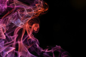 Background, orange, pink and white colored smoke shapes on black background