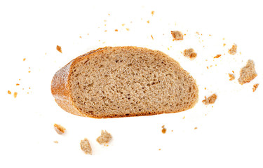 Bread slice and crumbs isolated on white background. Top view.