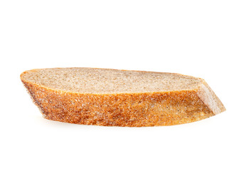 Freshly baked bread isolated on a white background. Crumbs and Bread slice close up. Top view.