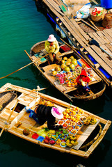 The Vietnam flowing market on the boat in Ha Long bay