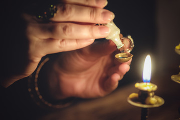 The withccraft. Wizard is holding in hand a magic potion close up.