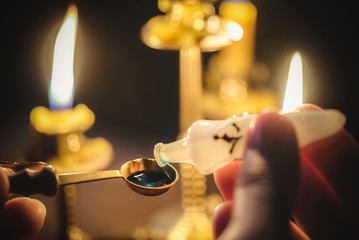 The withccraft. Wizard is holding in hand a magic potion close up.