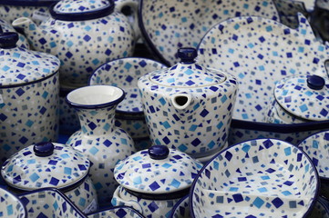 Closeup handmade pottery with blue pattern produced in Boleslawiec, Poland