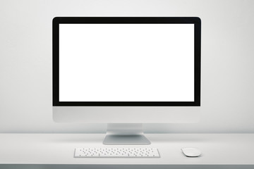 Blank screen computer display for mockup in office interior, Work desk with keyboard and mouse.