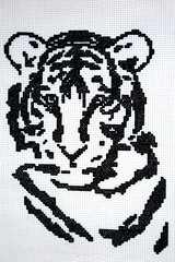 Beautiful handwork, embroidery depicting a tiger, made in black and white. Symbol of the year for the Chinese calendar 2010 and 2022.