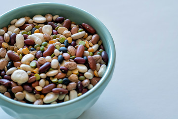 Colorful beans in a blue bowl