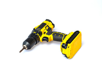 The yellow cordless battery powered drill isolated on white background.