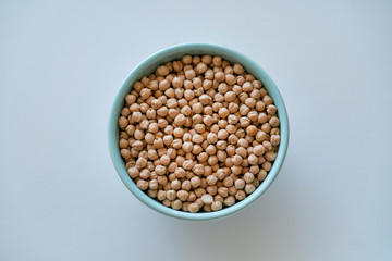 Raw chickpeas in a blue bowl