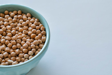 Raw chickpeas in a blue bowl