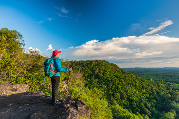 Fototapeta na wymiar Young woman hiking on Mountain, Pha Daeng viewpoint, Na Yung Nam Som National park, Udonthani province , Thailand.