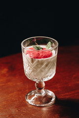 Stock Photo - Dessert panna cotta with fresh berries on a dark background
