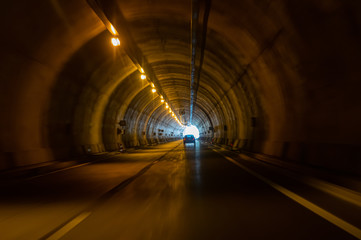 A road, light and tunnel