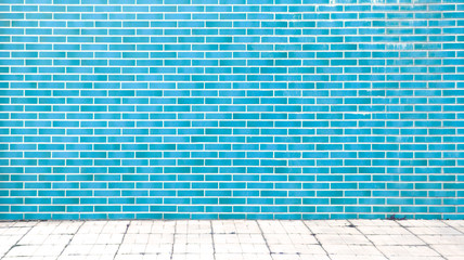 blue brick wall background with gray floor